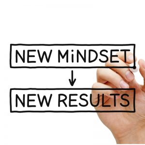 hand holding a marker as if marker is writing on screen "new mindset" with arrow pointing down "new results"